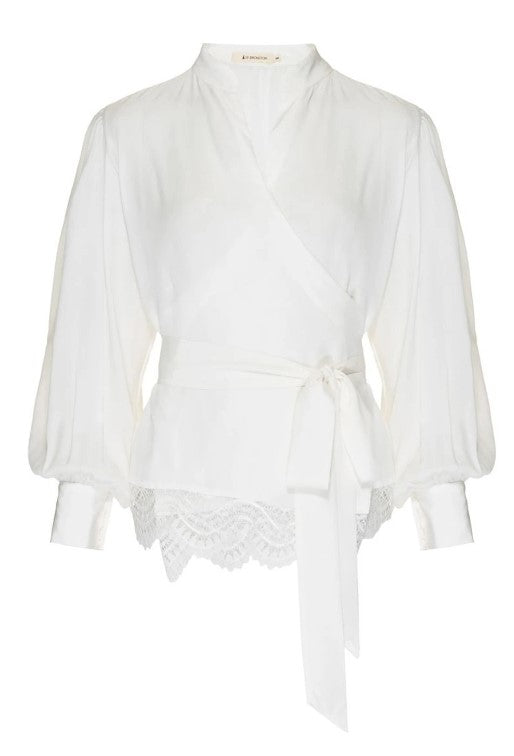 Introducing the LETHICIA BRONSTEIN Cache-Coeur Blouse Auzira in Off-White Silk, featuring a v-neckline, tied waist, long sleeves with cuffs, and lace-trimmed hem for an elegantly textured look that redefines sophistication.